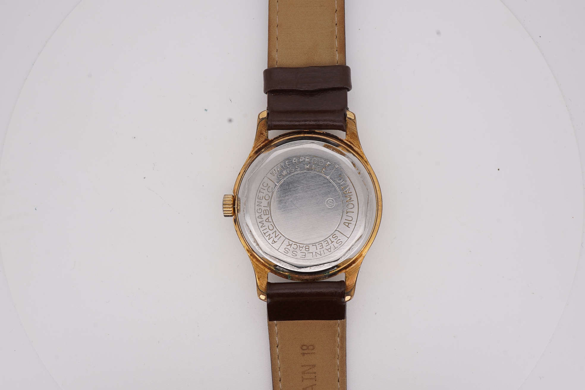 A gentleman's steel and gold plated Montfort Superautomatic wrist watch, with Roman and quarterly Arabic numerals, case diameter 34mm, on a later associated leather strap.